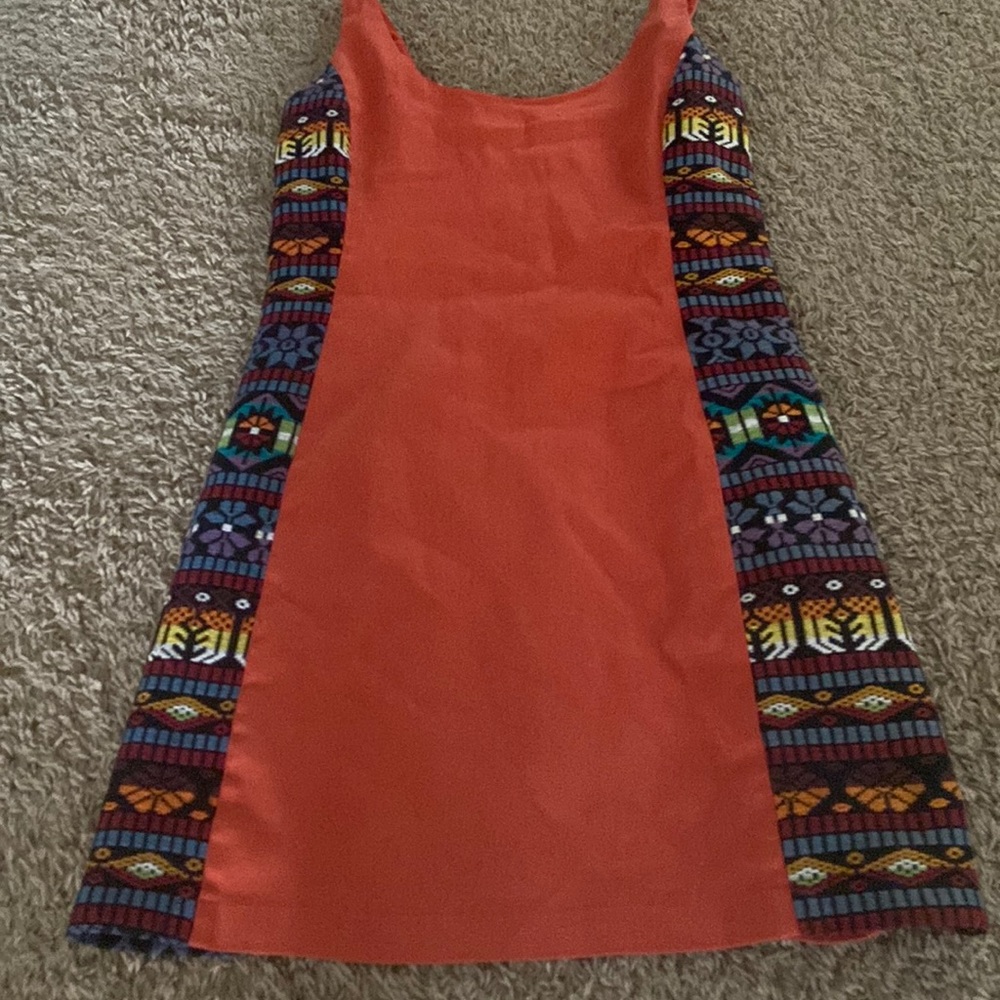 Orange colorful mini dress. Comes to about knee length